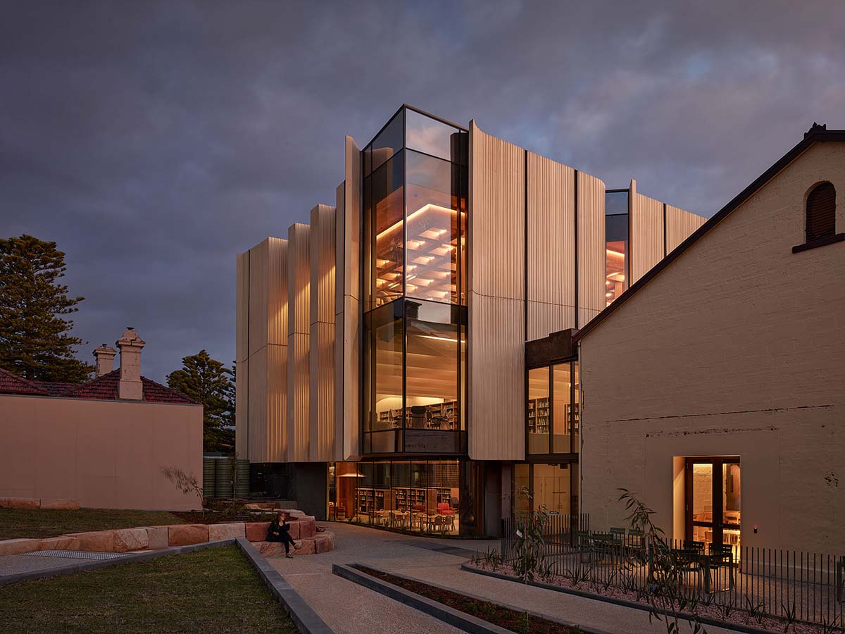 View of the contemporary extension at dusk.
