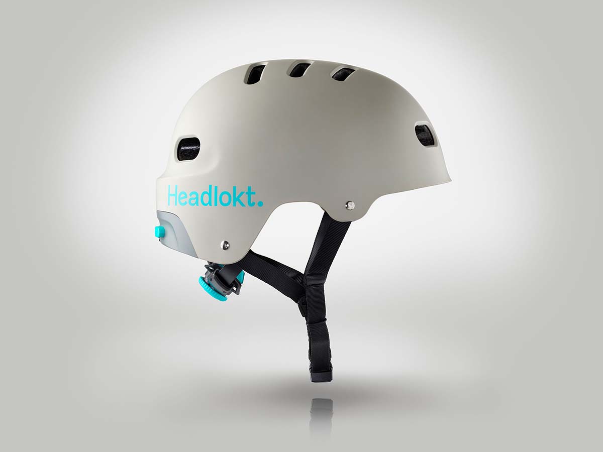 Side view of white Headlokt OneLock helmet