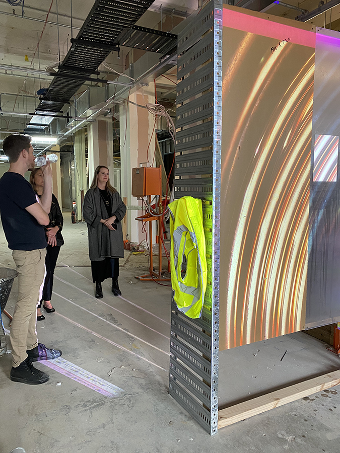 A team assessing an earlier prototype of the blade design and testing different film applications on projection quality