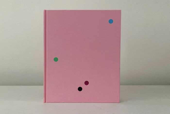 Video still of pink book cover