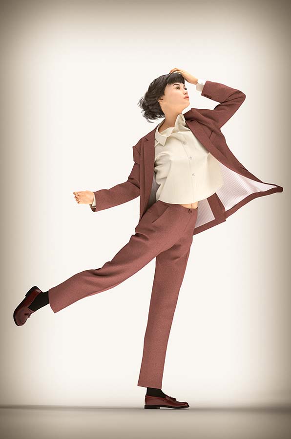 Female avatar wears dusty pink suit with cream shirt, side view with elbow up, left hand on forehead, right leg out and back.