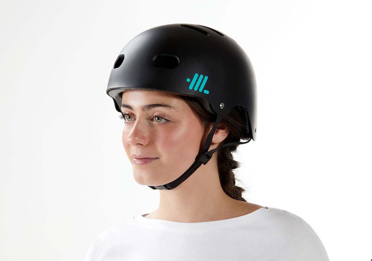 Front-side view of black Headlokt OneLock helmet worn by a cyclist