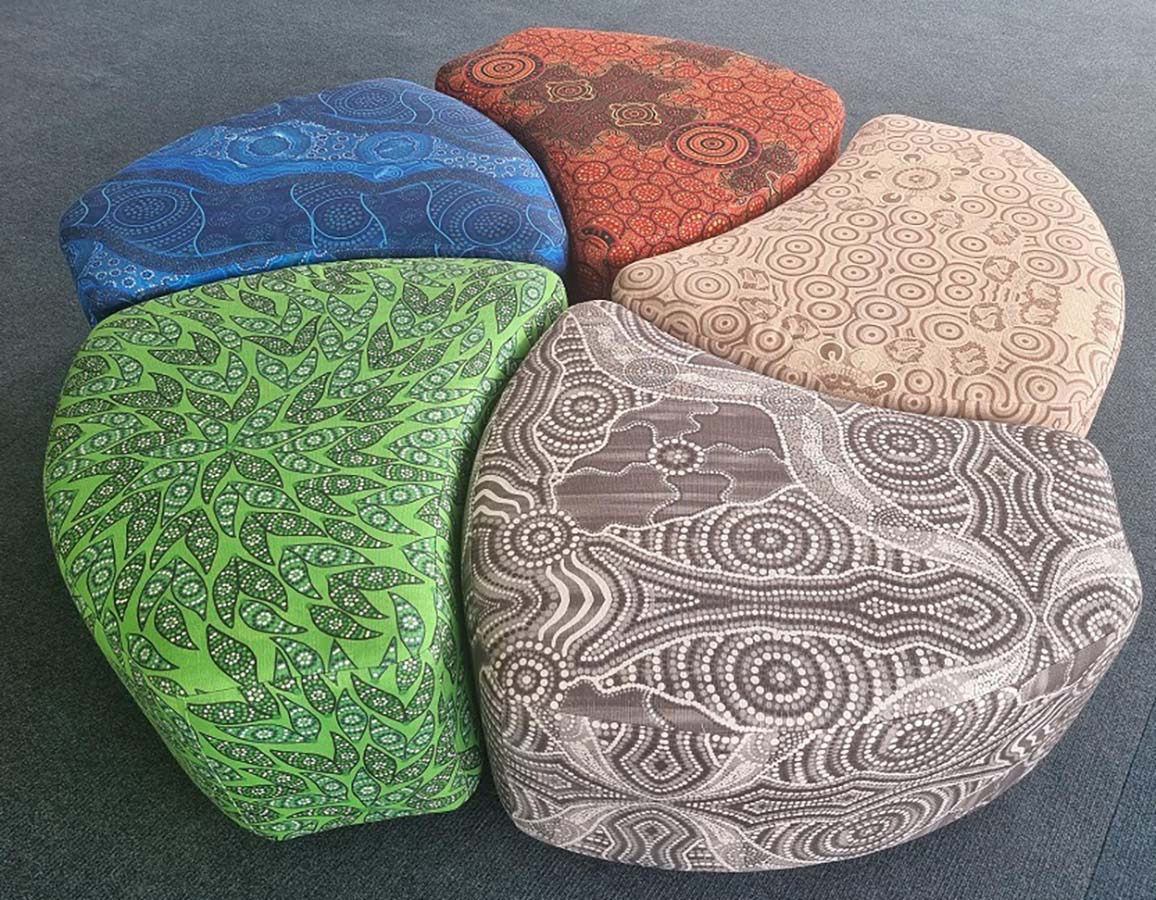 Cluster of 5 Iris Ottomans upholstered in 5 of our Indigenous fabrics.