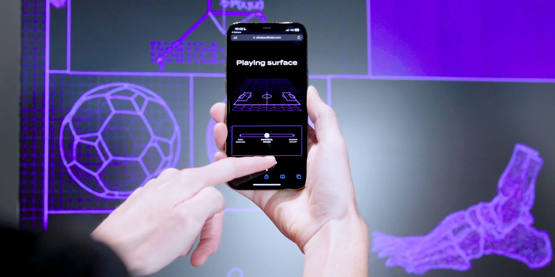 An iPhone in front of the boot wall digital screens, user is navigating the Boot Finder.