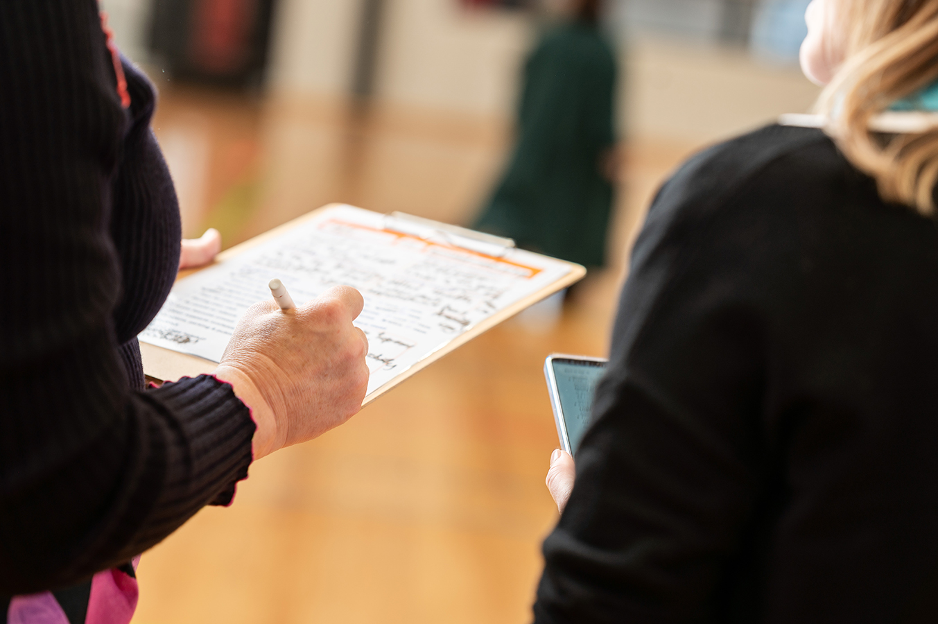 Photos of user testing SMS process and wording