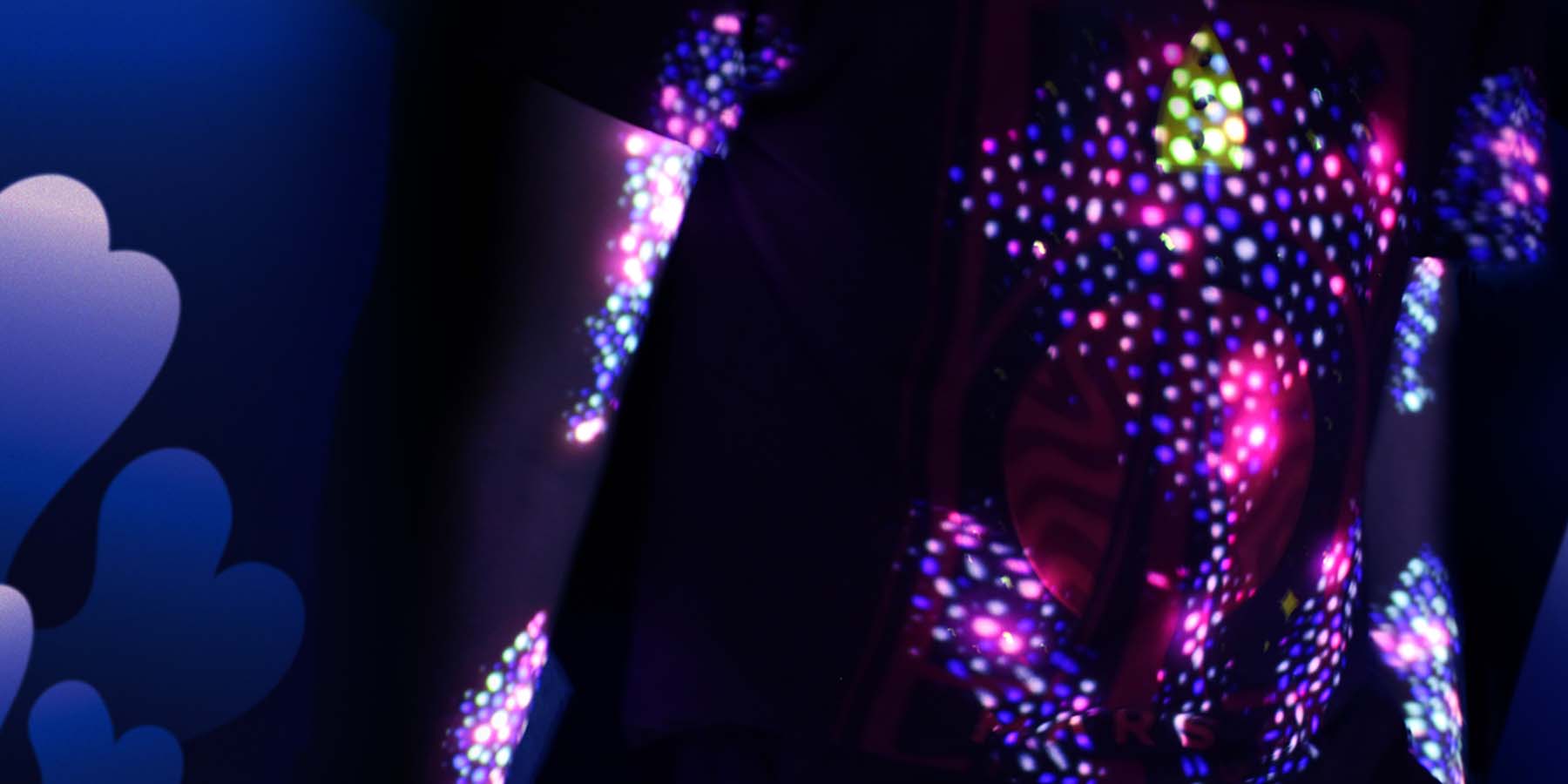 Animated bio dots are projected onto the user's body, turning them into magnificent bioluminescent creatures.