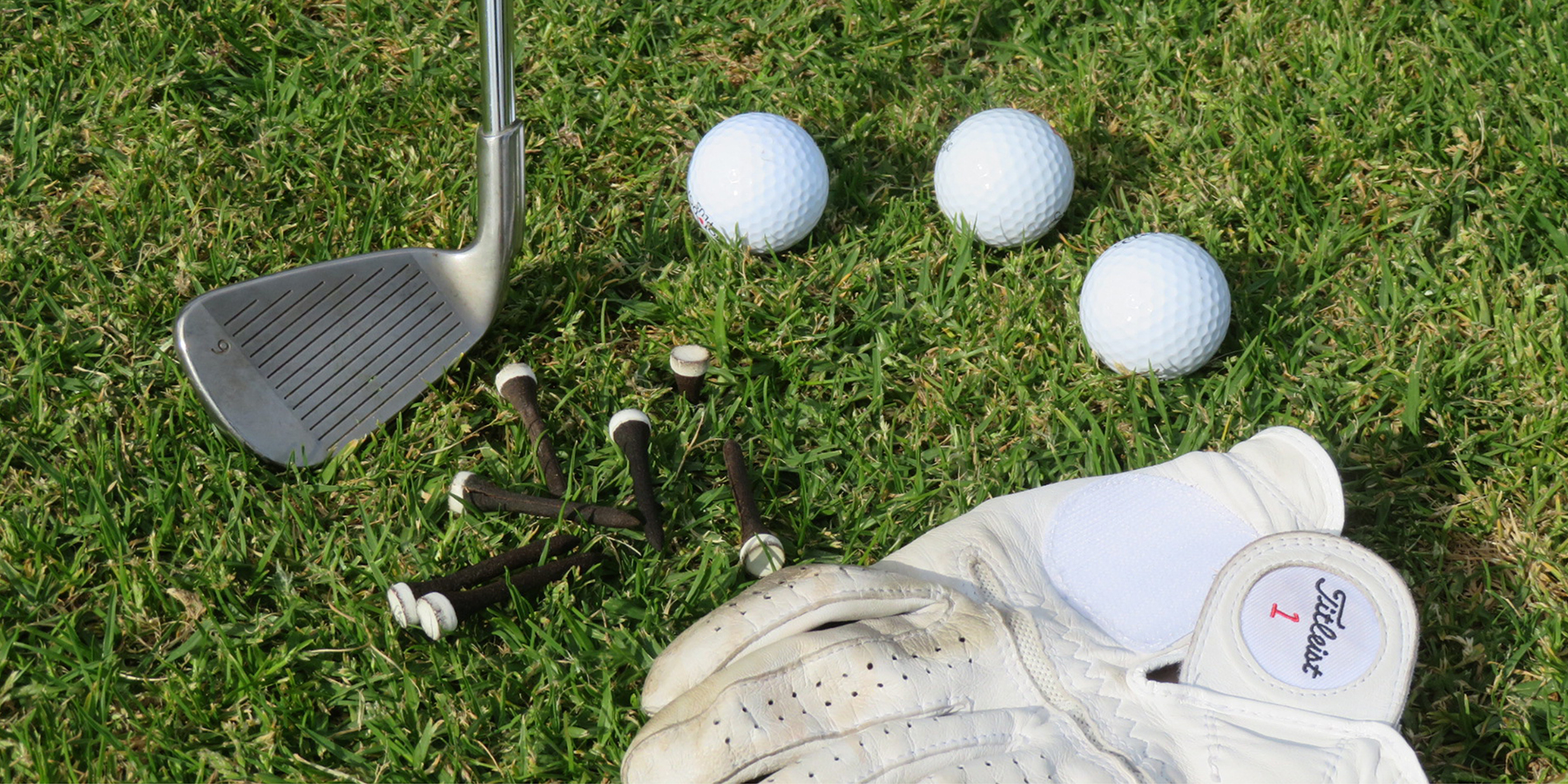 Grounds for grounds' biodegradable golf tee with various golfing equipment