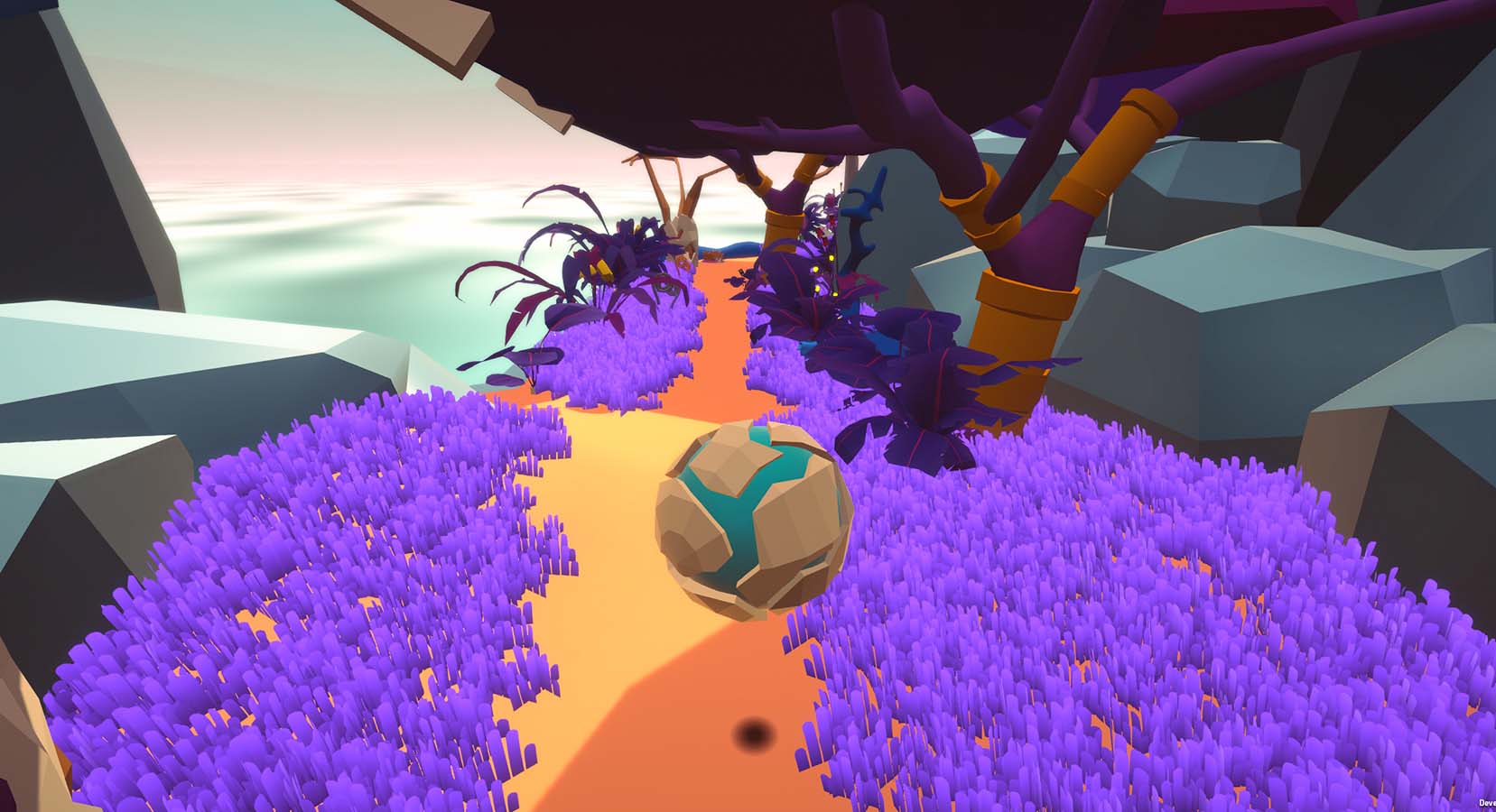 In-Game sceenshot of the player character in their ball form travelling through a grassy field