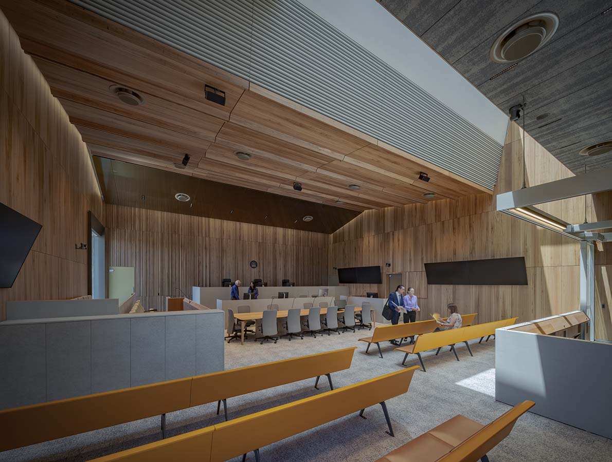 The character of each courtroom differs slightly with warm, familiar materials