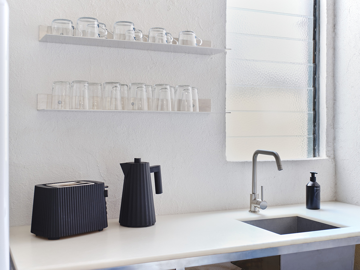 Contemporary studio kitchen with recycled HDPE bench, aluminium and stainless steel fixtures.