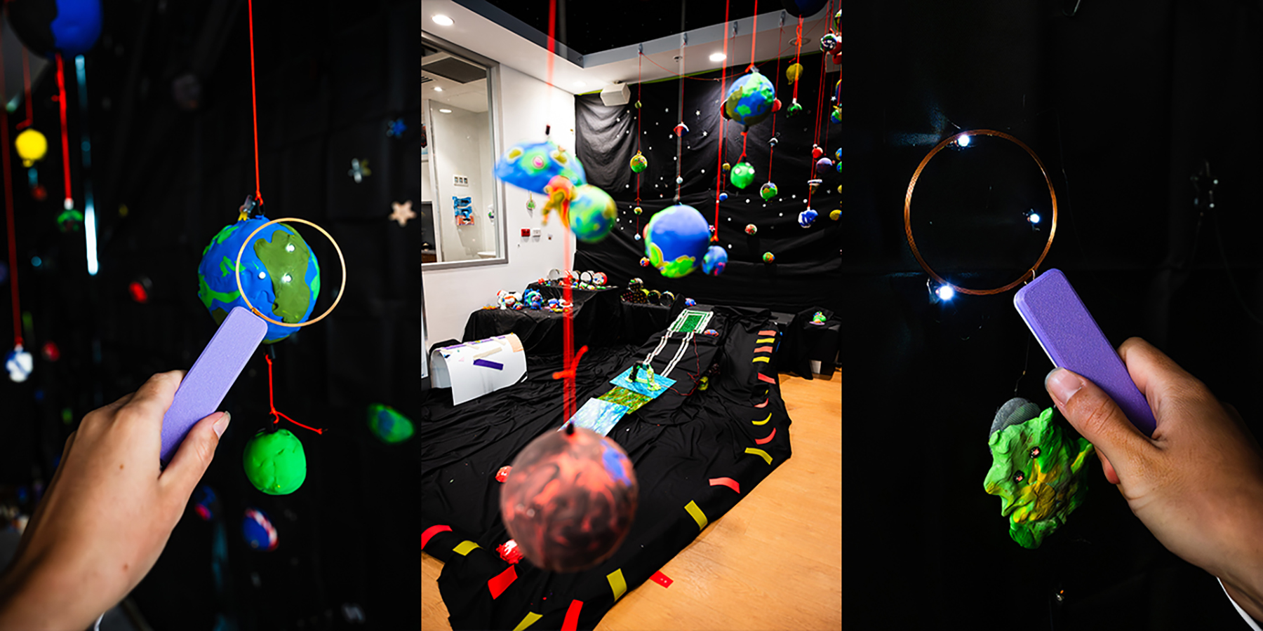 Colourful planets light up when a child holds a inductive coil wand near them.