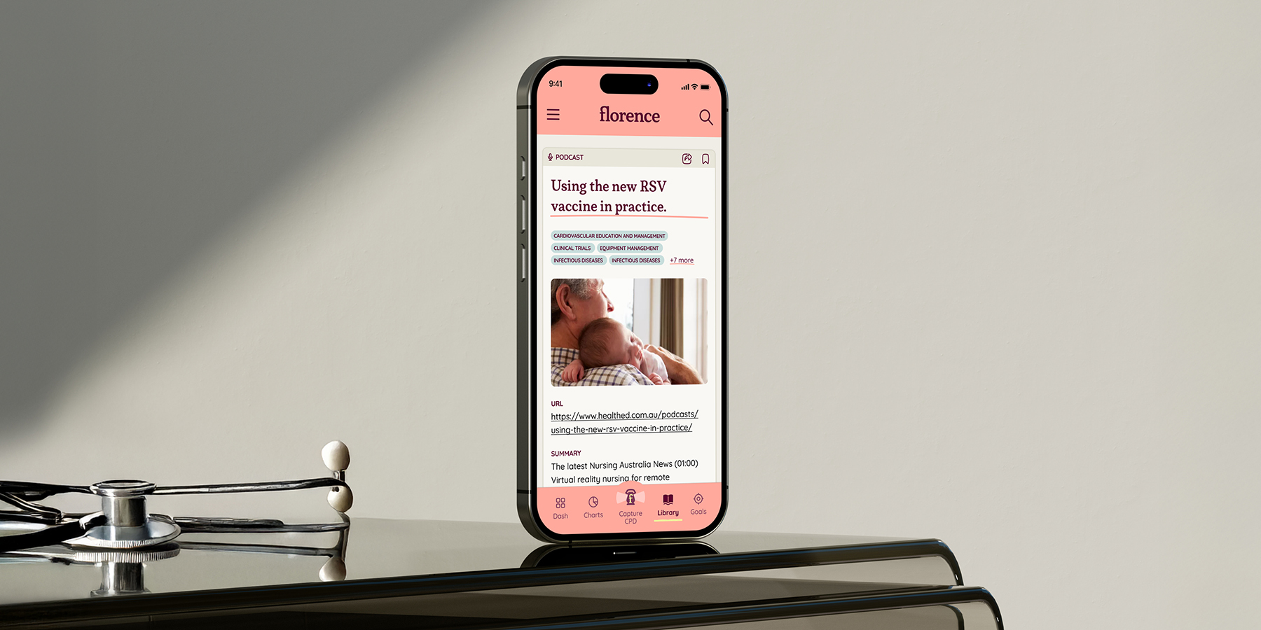 Florence app open on phone displaying a podcast article with an elderly man holding a baby.