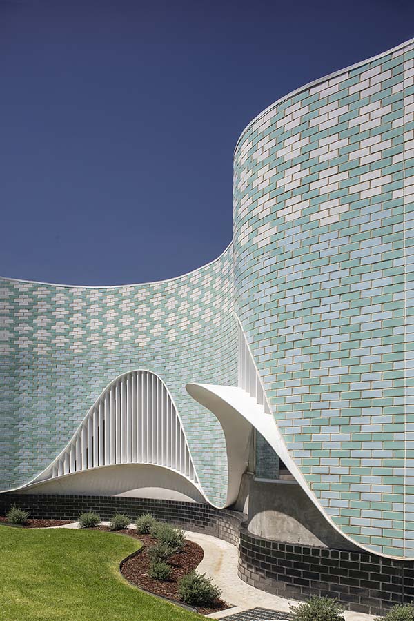 A closer view of the PEGS Music Centre façade - the colour palette a chorus of white, sky blue and turquoise glazed bricks. Photo by John Gollings