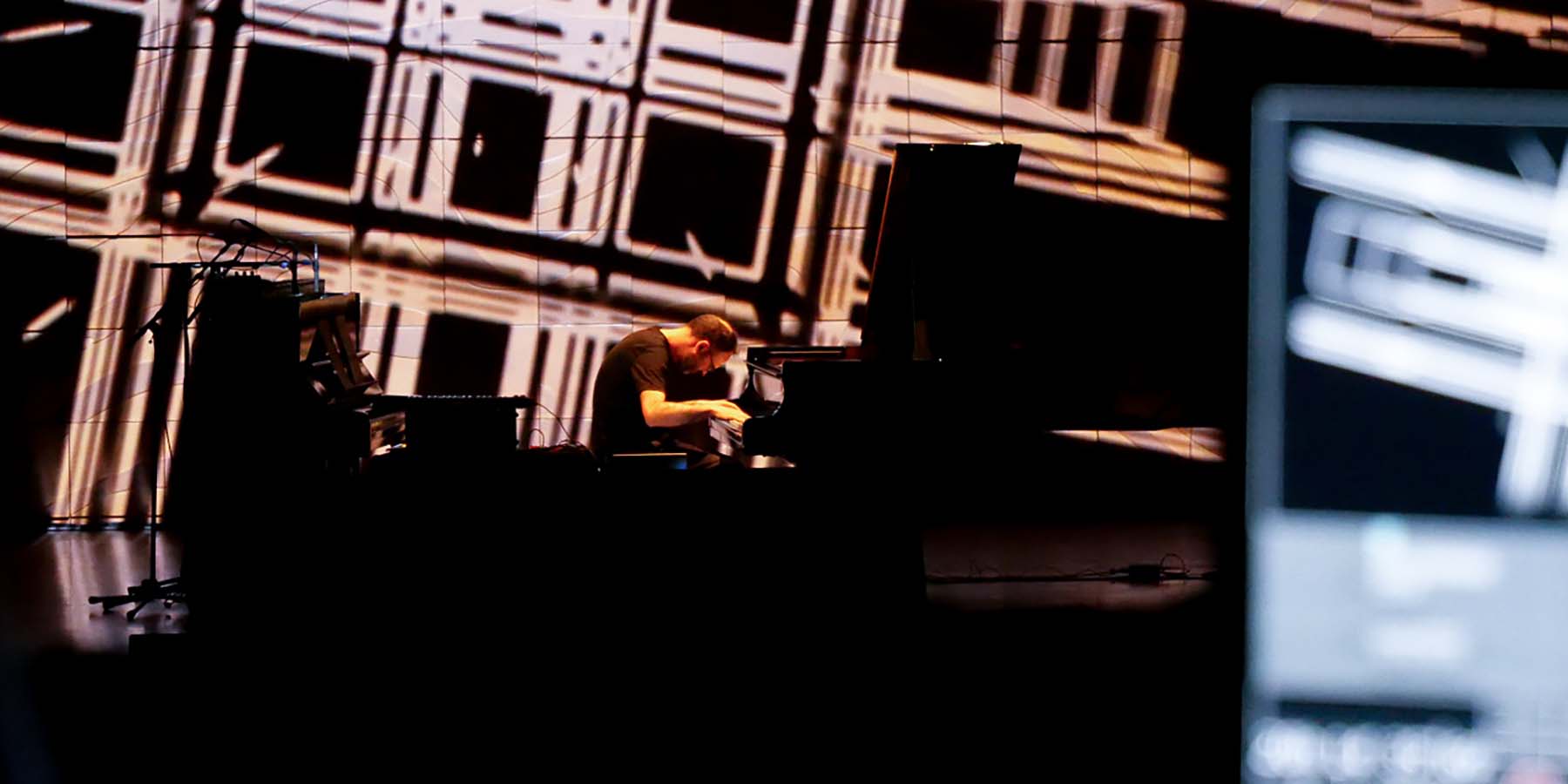 Luke Howard performing within an immersive digital experience at Melbourne Recital Centre.