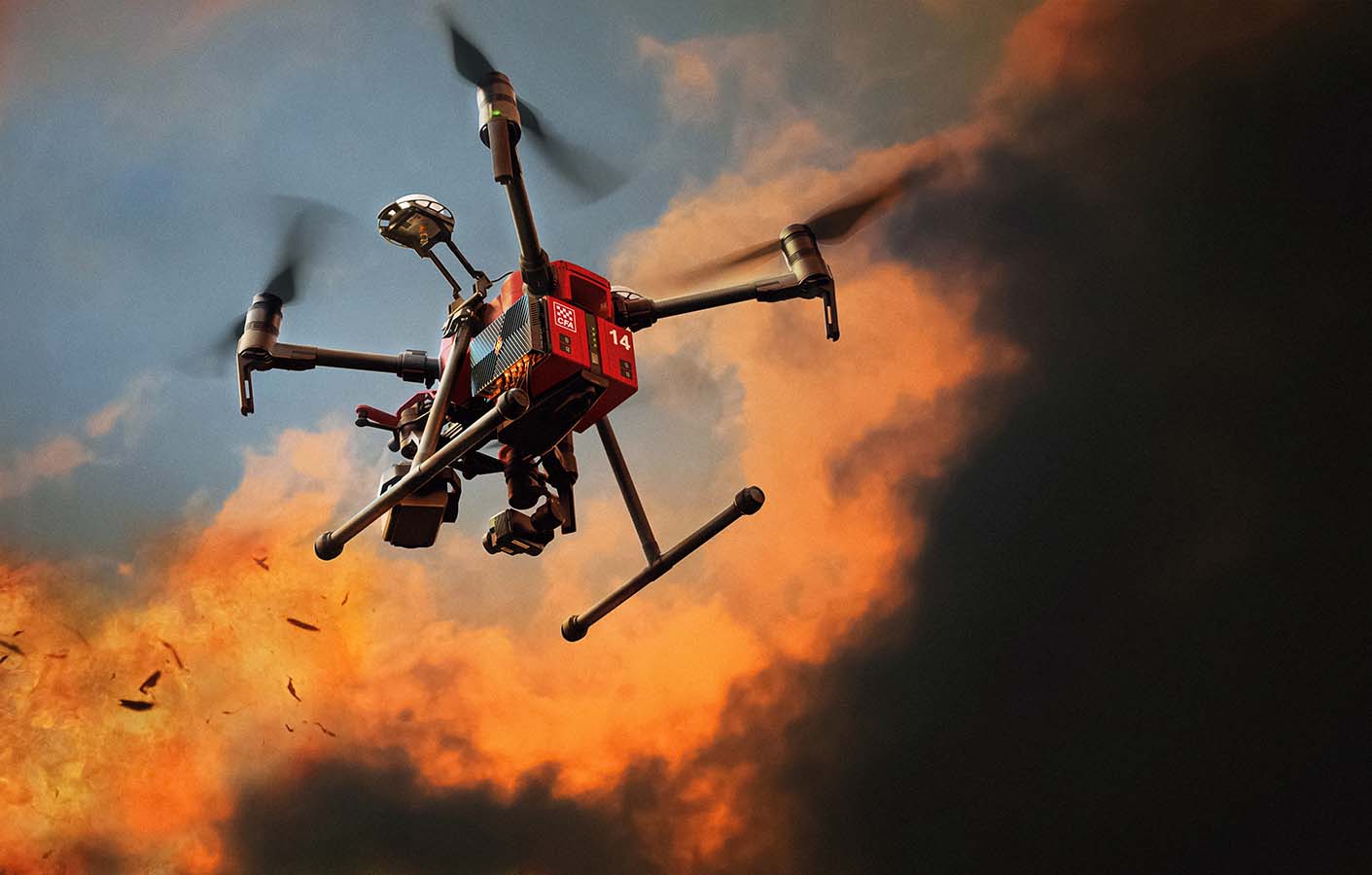A visualisation demonstrating the HyphaMAP device mounted to a drone, which is flying through a bushfire scenario.
