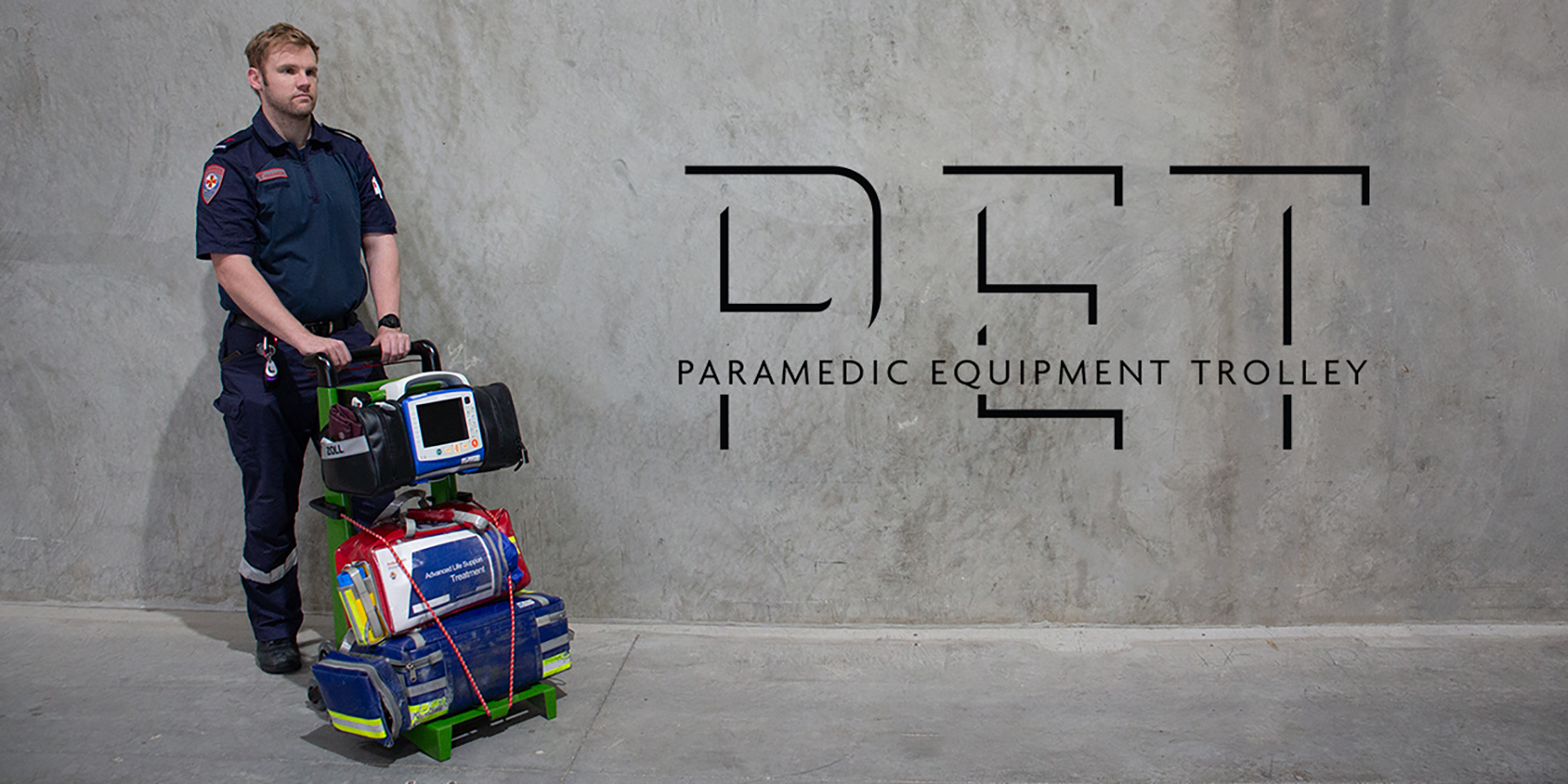Paramedic with a fully loaded trolley and the P.E.T logo.